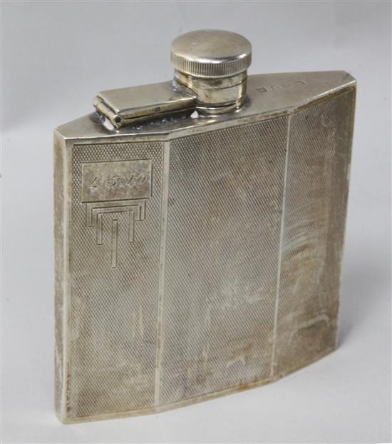 A 1930s Art Deco engine turned silver hip flask, 10.3cm.